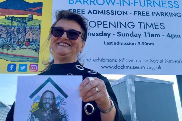 Lilliana Myers holding Dave Museum poster